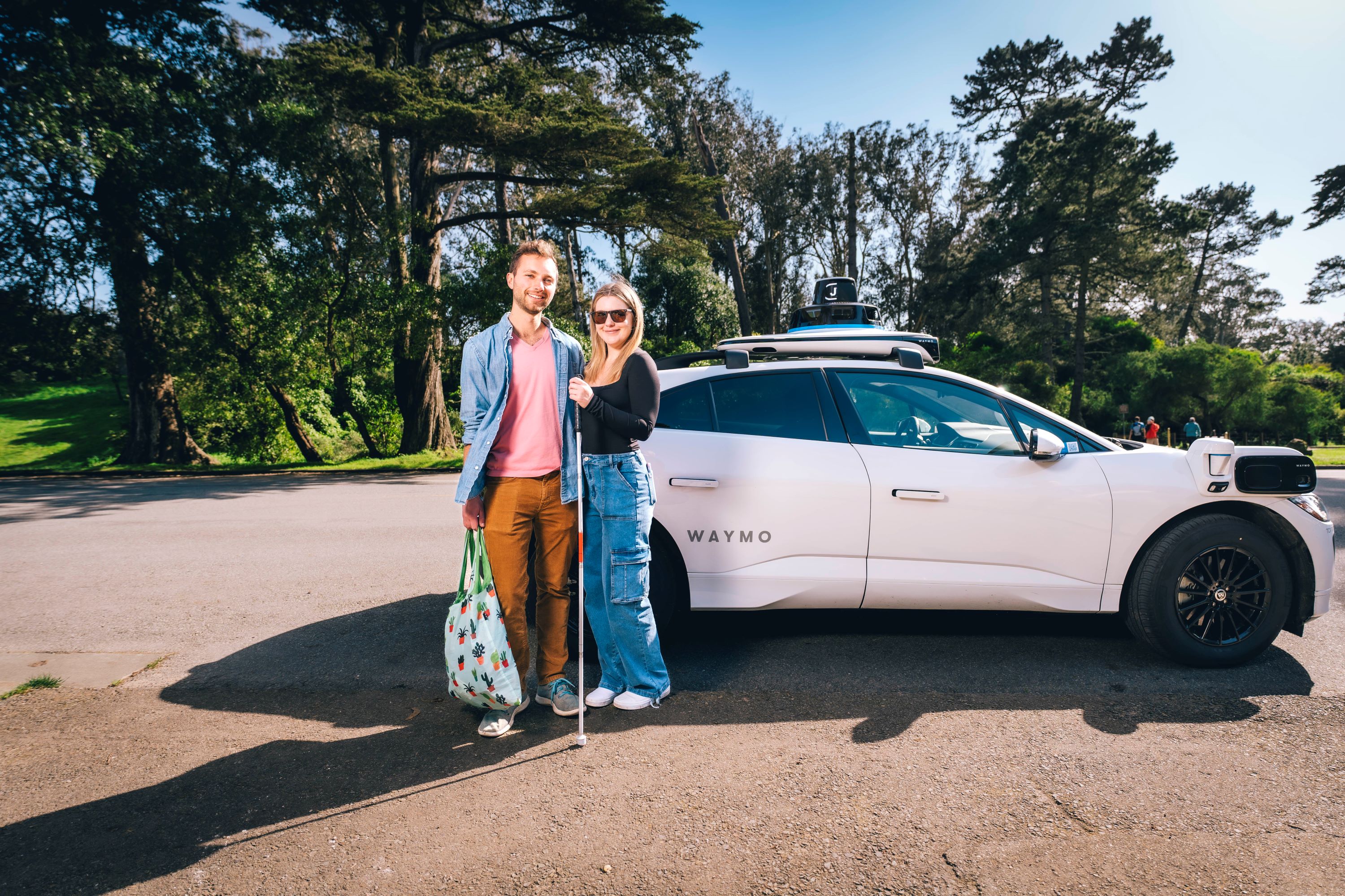 Jessie Wolinksy and her boyfriend Nick preparing to enter a Waymo in Golden Gate Park.