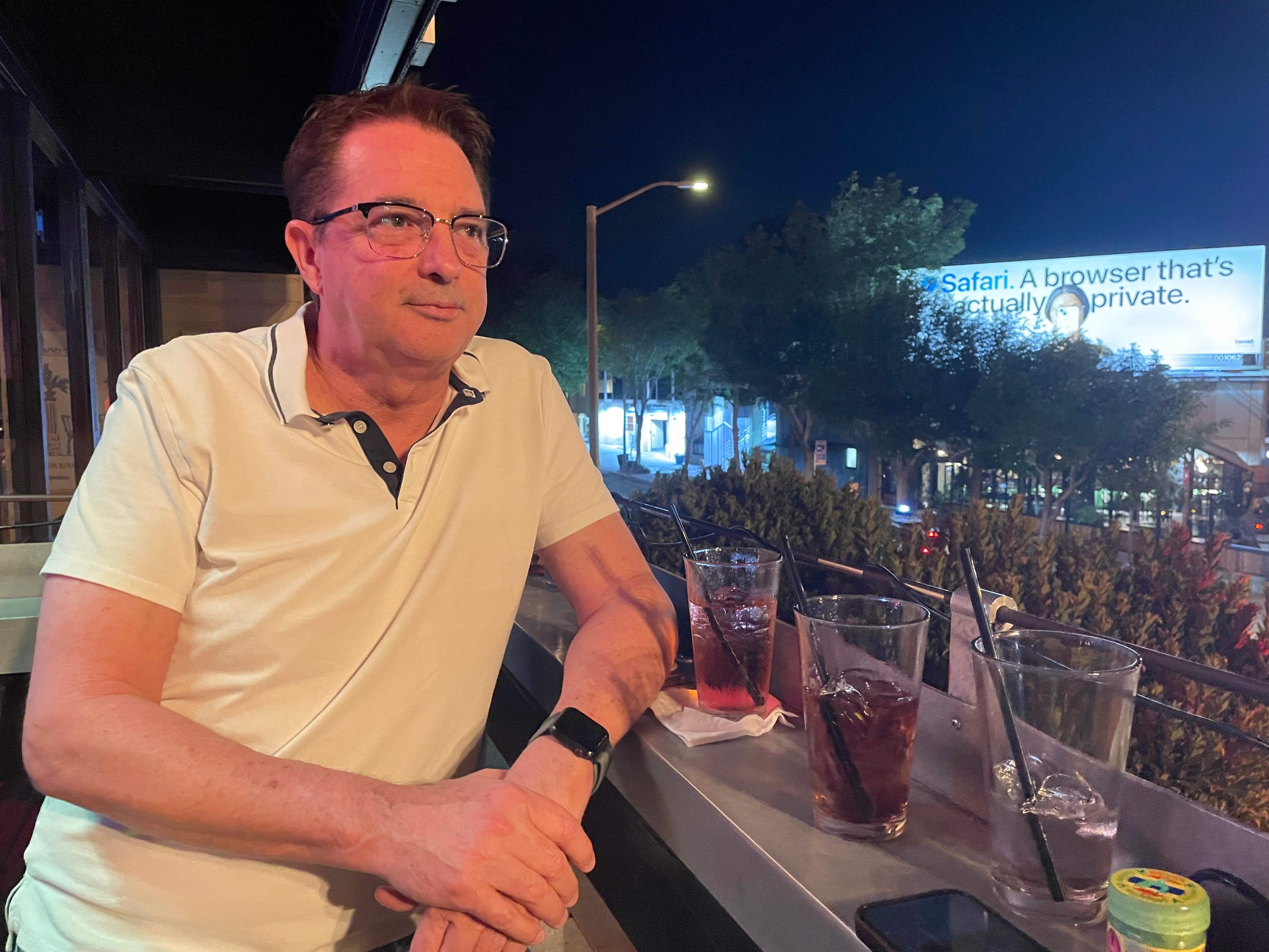 A man sits at a bar.