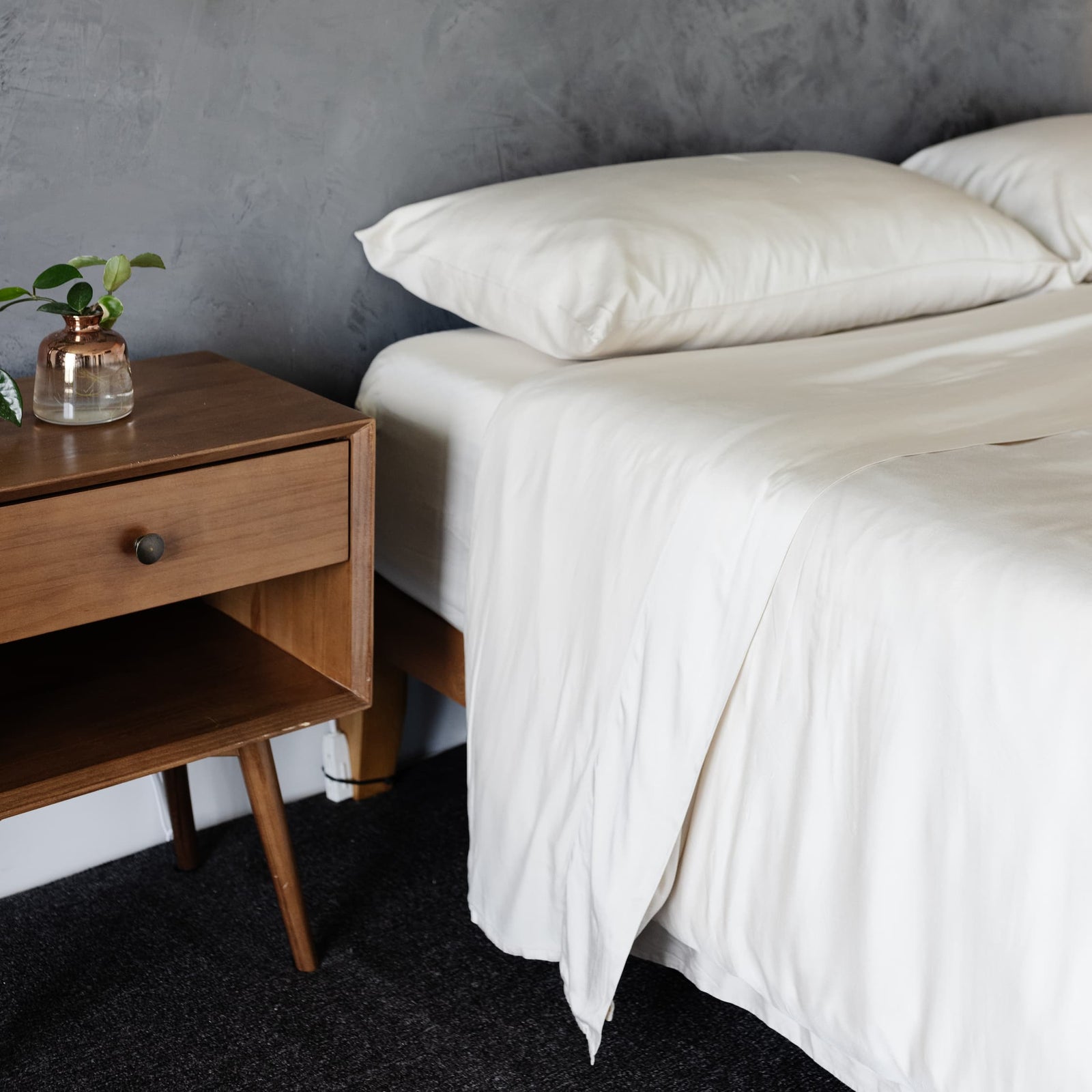 Bed with oat bedding in a dark bedroom 