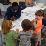 adult working with children at science center