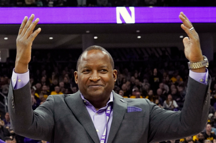 Northwestern Athletic Director Derrick Gragg gestures during the first half of an NCAA college basketball game in Evanston on Sunday, Feb. 19, 2023.
