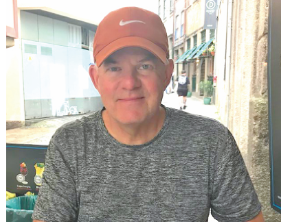 Handicapper Paul Stone finding some rare time to relax, lunching at a sidewalk cafe in Porto, Portugal. 