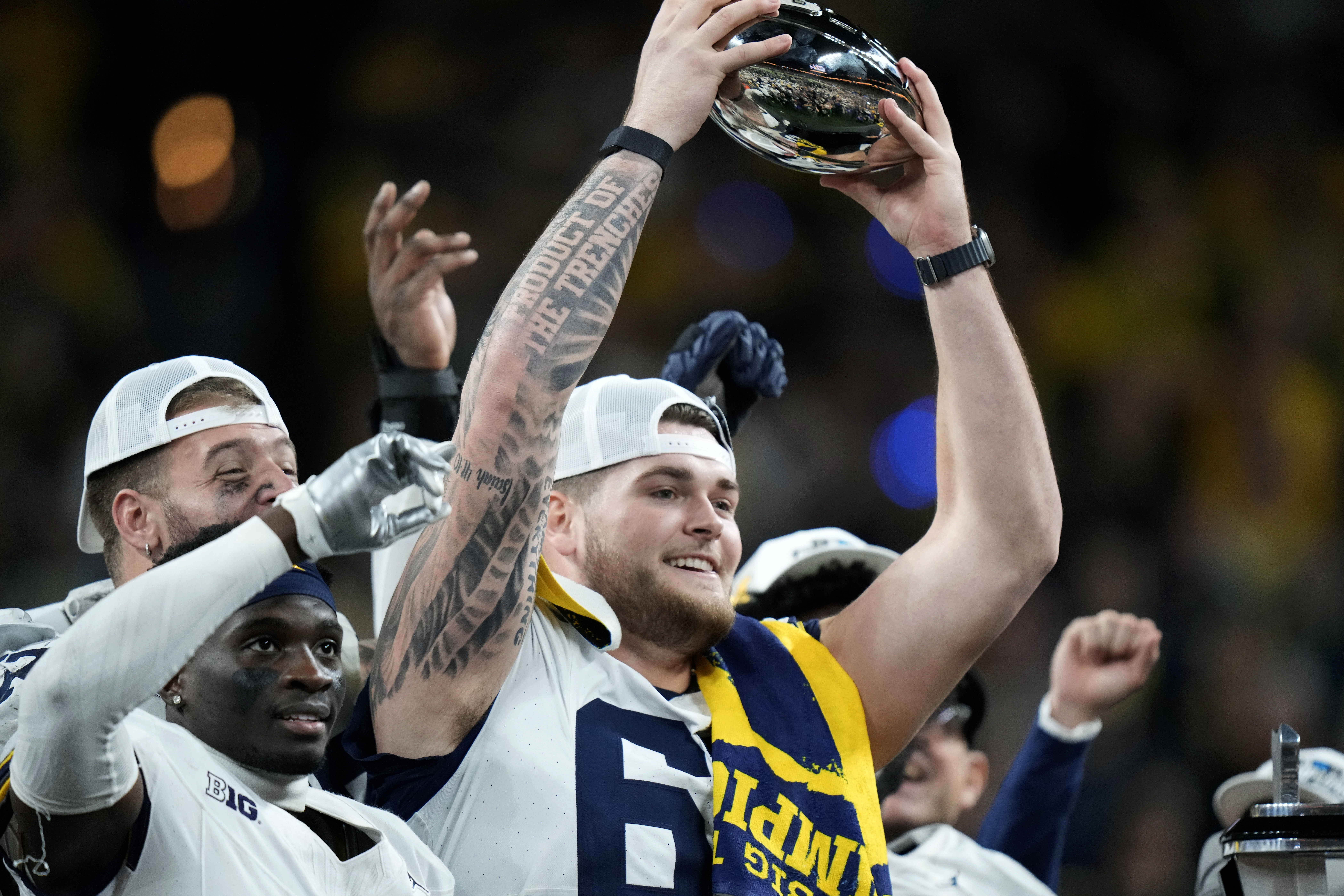 Michigan offensive lineman Zak Zinter (65) didn’t enter last year’s NFL Draft and instead stayed for his senior season and helped the Wolverines win a national title. 