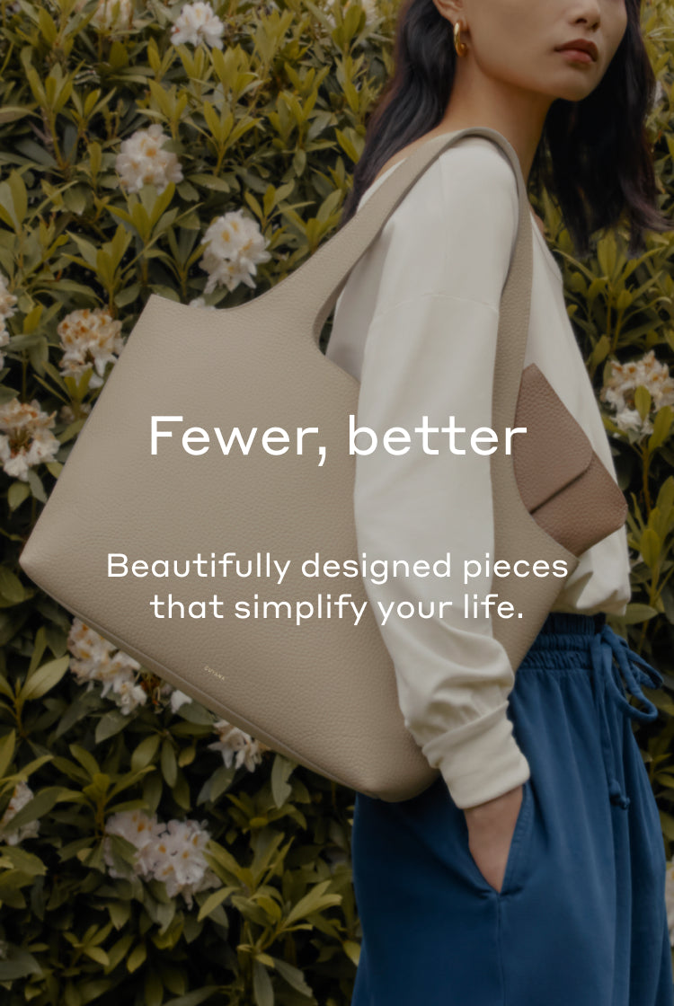 Person with a large shoulder bag, text overlay saying fewer, better and beautifully designed pieces.