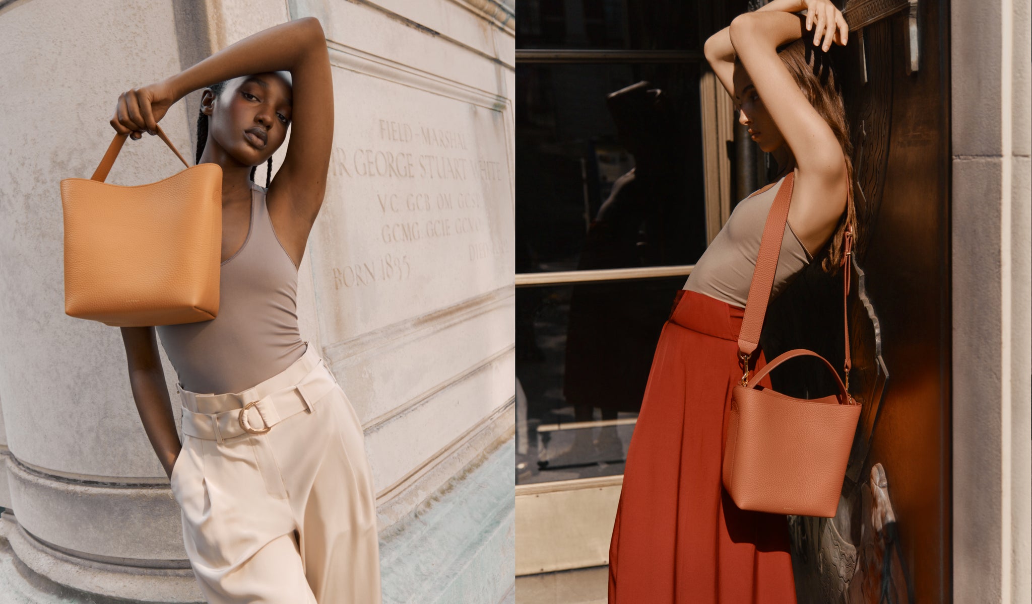 Two women posing with handbags in an urban setting.