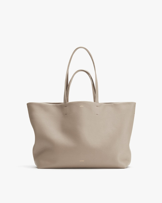 Large tote bag with two handles standing upright