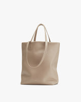 Plain tote bag with two handles, standing upright.