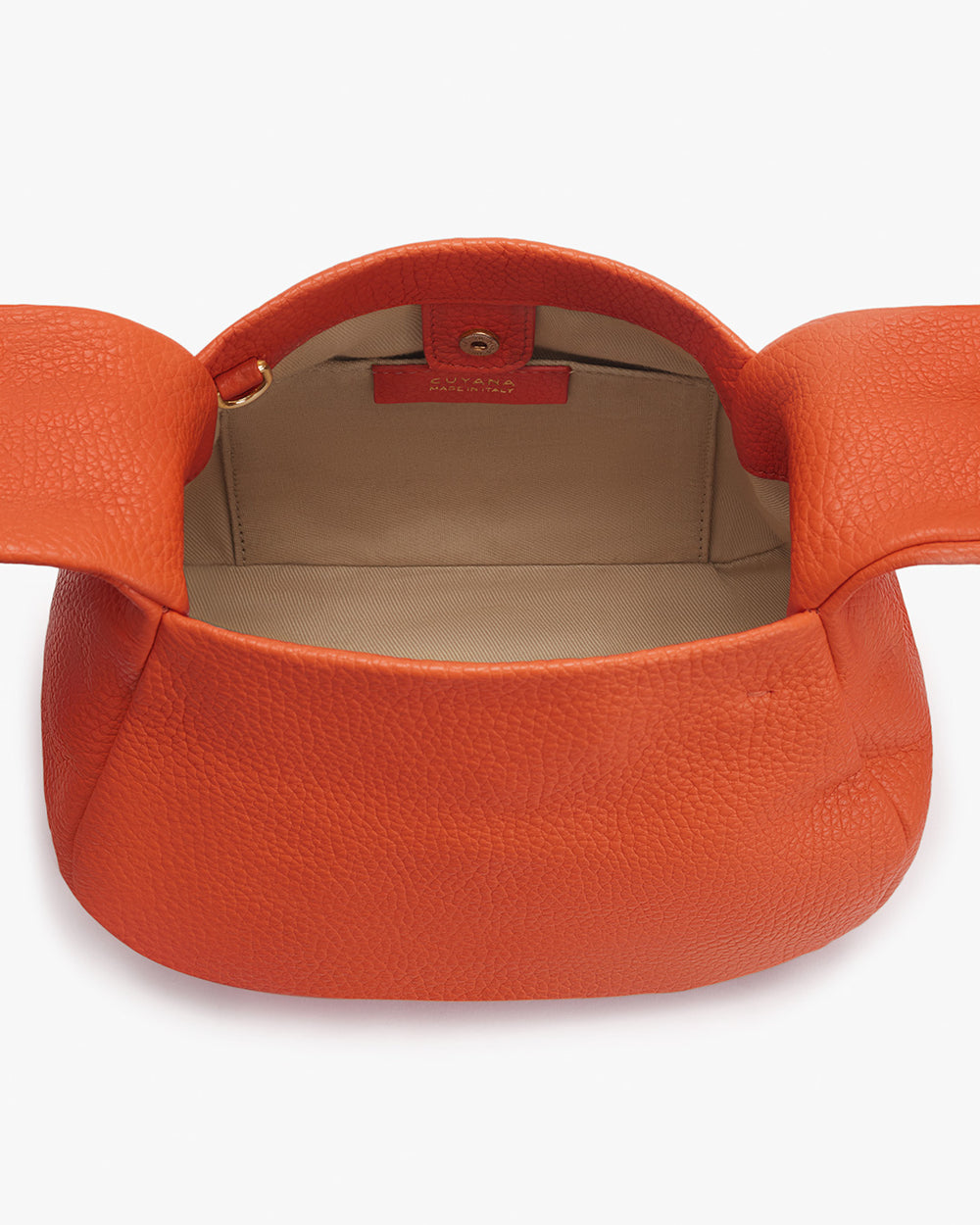 Open handbag with interior compartment.