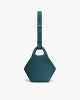 Handbag with an adjustable shoulder strap and a geometric shape
