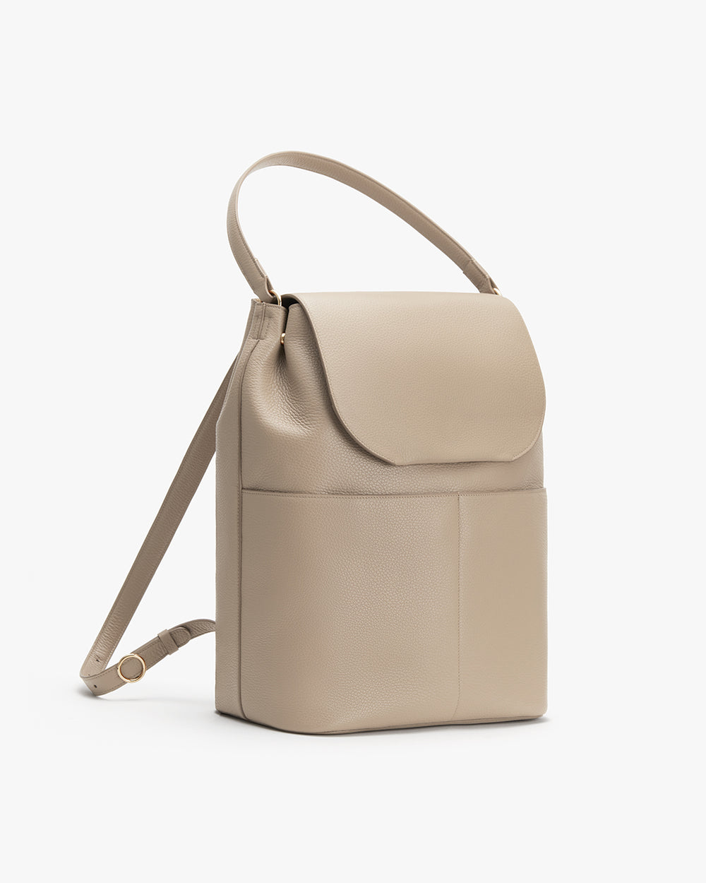 Vertical shoulder bag with flap and adjustable strap.