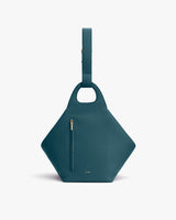 Purse with a geometric shape and a top handles.