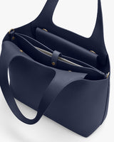 Open handbag with visible interior compartments.