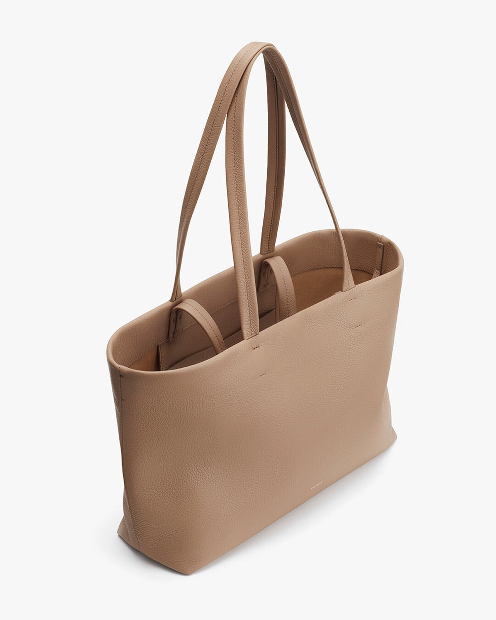 Tote bag with two handles standing upright on a plain background.