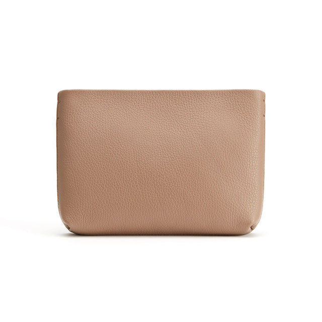 Leather pouch on a plain background.