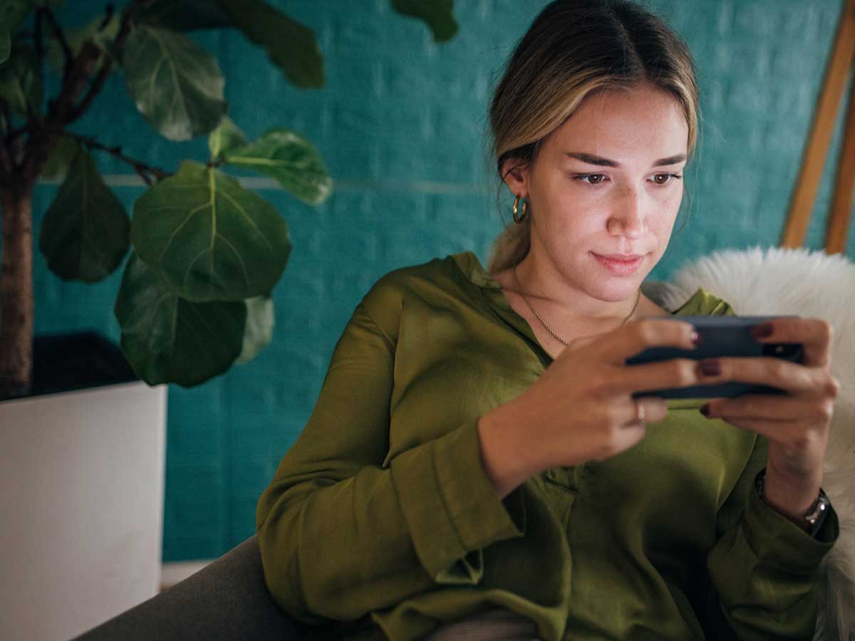 Woman holding Mobile Device