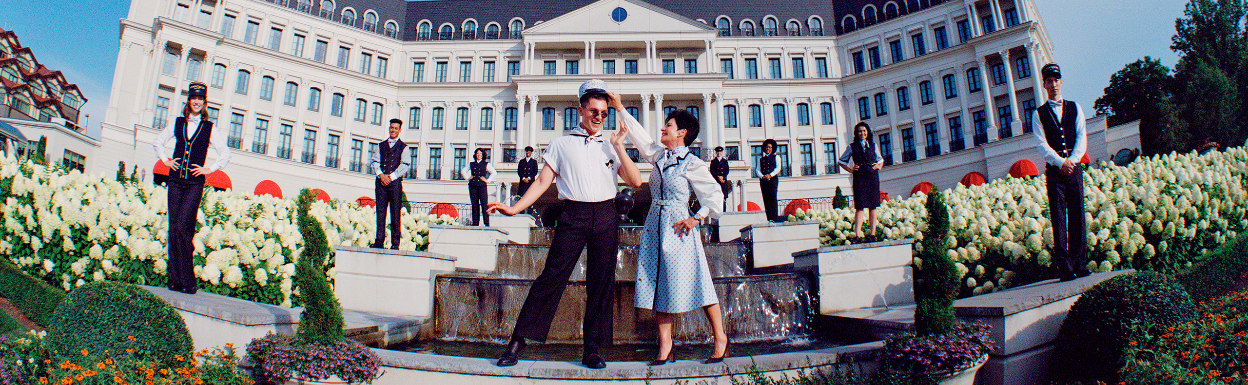 two people outside of a hotel