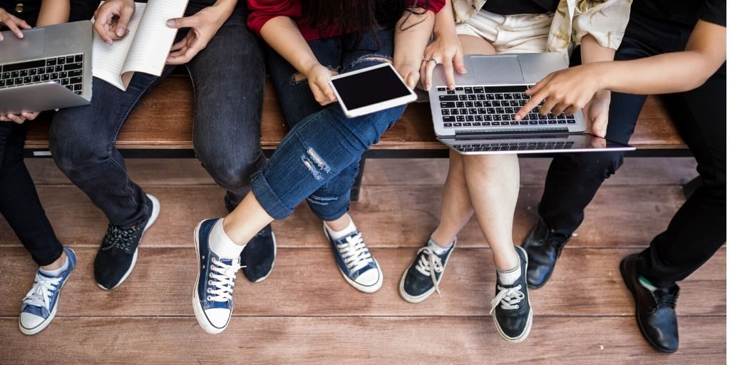 students on laptops birds eye view