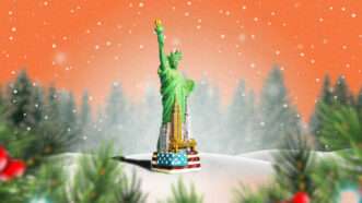 The Statue of Liberty surrounded by the New York City skyline sits in a snowy field with evergreen trees | Illustration: Lex Villena; Uladzimir Zuyeu