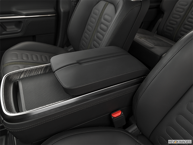 2025 Rivian R1S | Front center console with closed lid, from driver’s side looking down