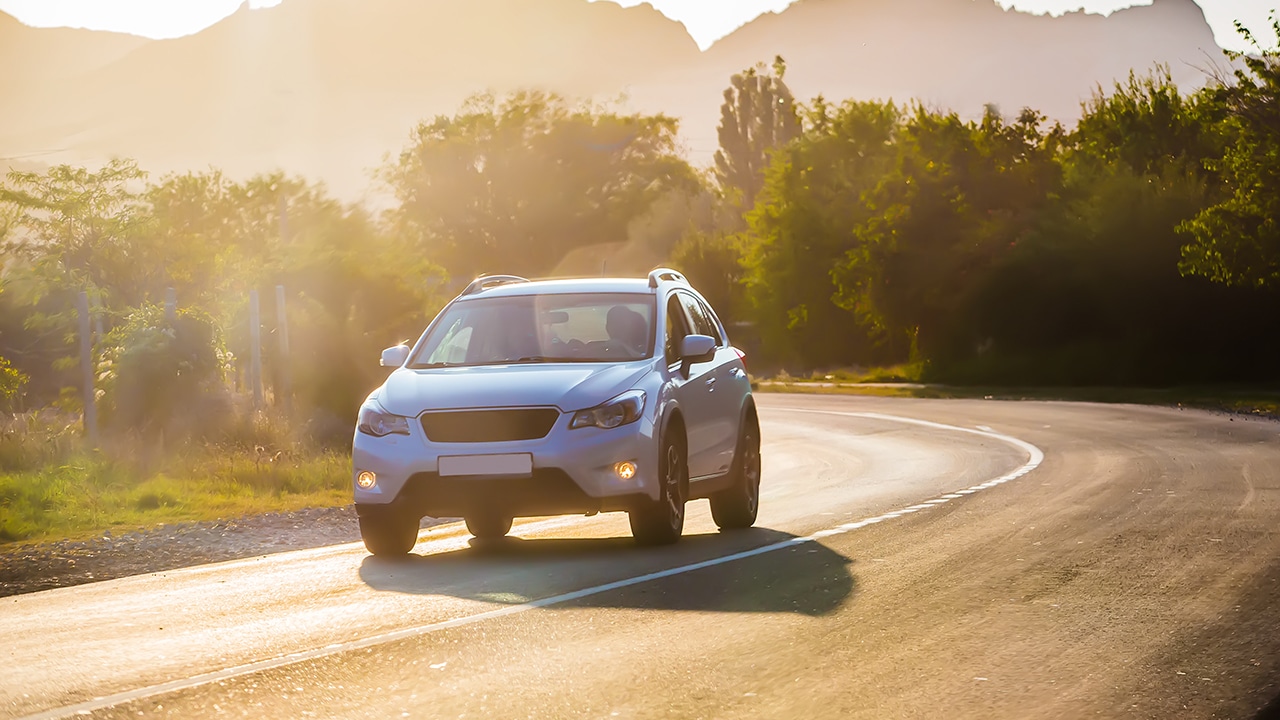 Crossover Rides the Highway in a Beautiful Mountainous Area