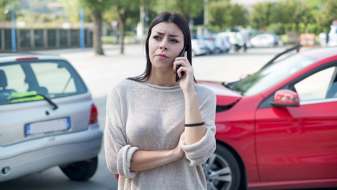 Woman calling towing service and roadside assistance