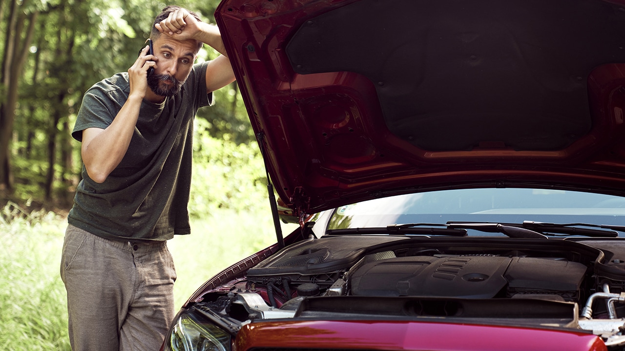 Man with a car problem using the phone for help