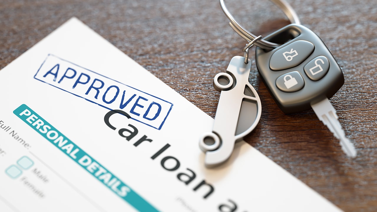 Approved car loan application with car keys