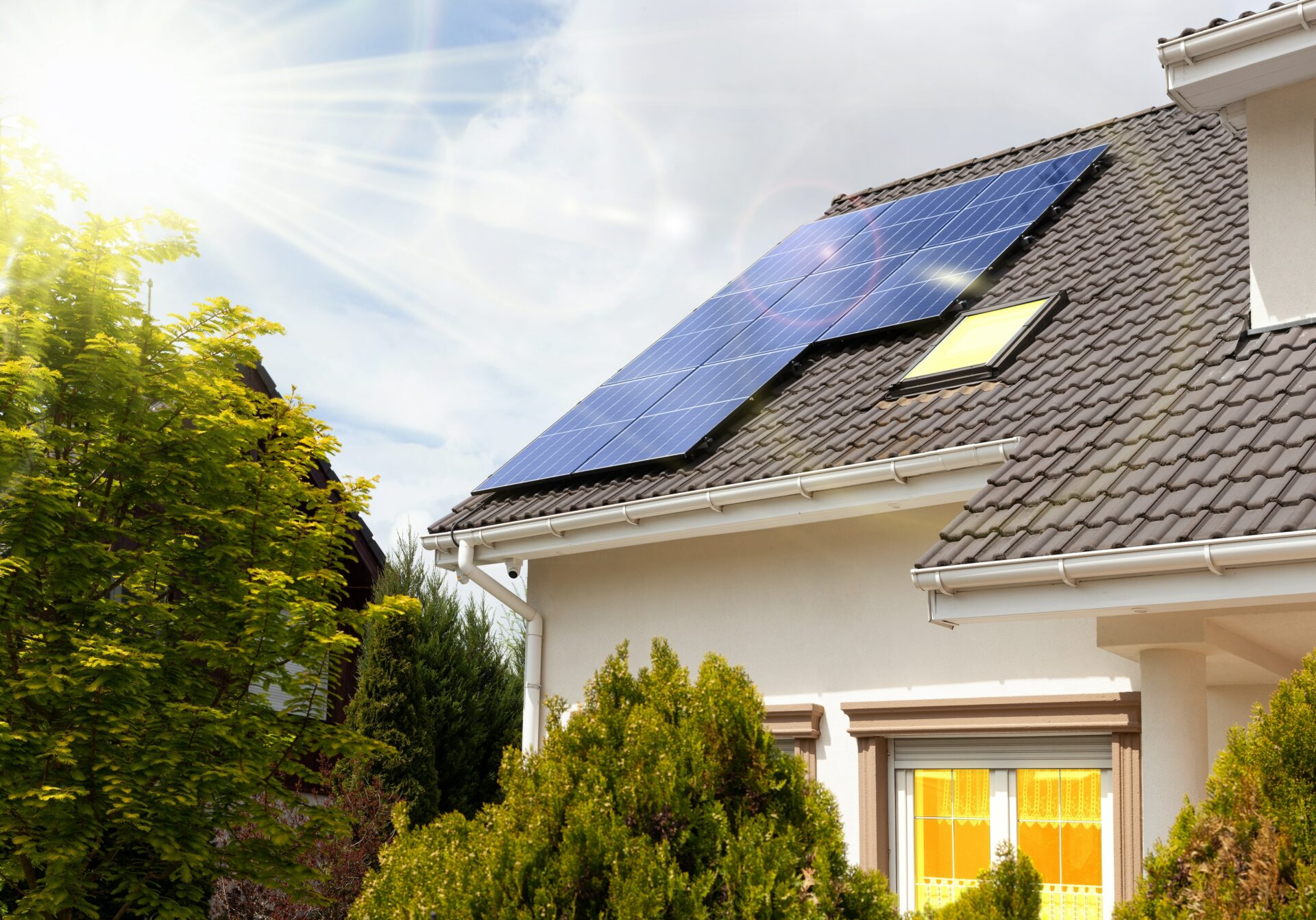 Solar panels on a gable roof. Beautiful modern house using solar energy.