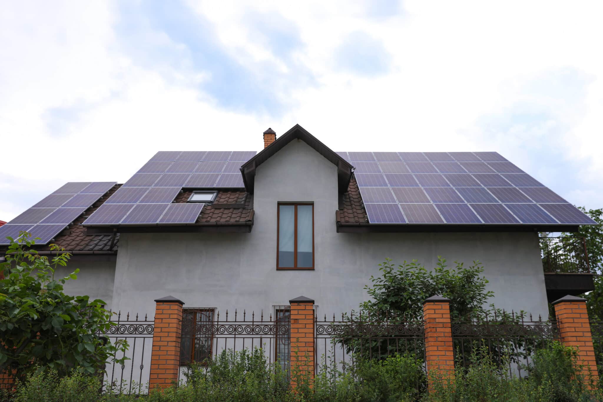 House with installed solar panels on roof. Alternative energy source