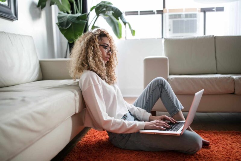 Woman using laptop for best online divorce service.