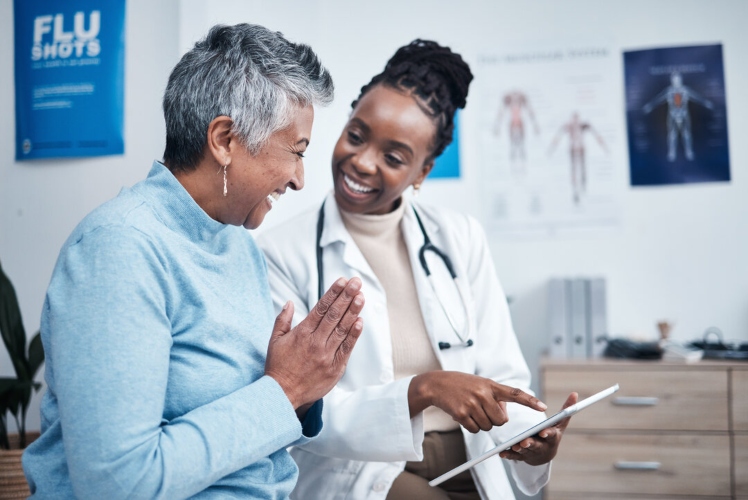 Older adult woman meeting with medical professional