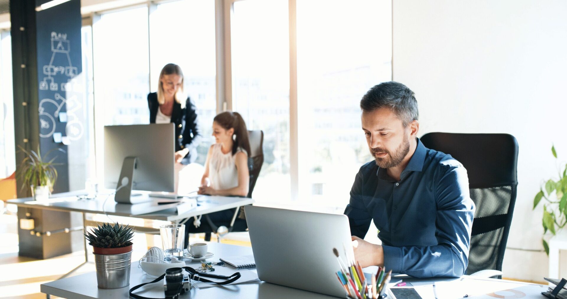 Three business people in the workplace