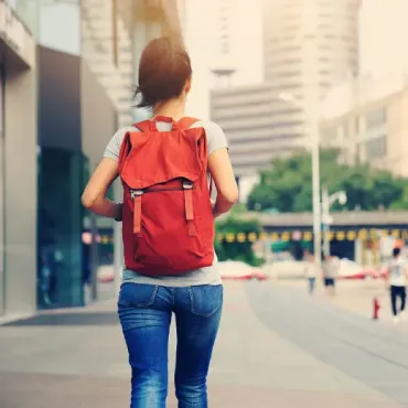 Woman with red backpack