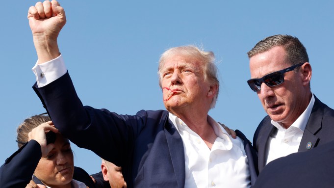 Republican presidential candidate former President Donald Trump is rushed offstage during a rally on July 13, 2024 in Butler, Pennsylvania.