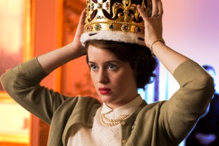 Queen Elizabeth II (Claire Foy) puts on her crown in Netflix's 'The Crown.'