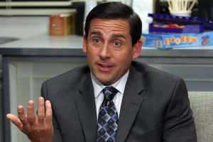 Michael Scott (Steve Carell) stares inot the camera while sitting down.