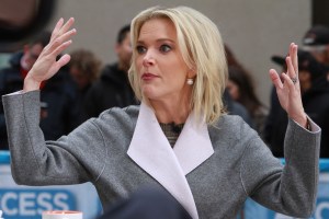 Megyn Kelly with her hands in the air