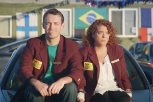 Michelle Wolf and Dan Soder sitting on a car