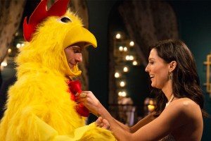 A man in a chicken suit and a pretty lady