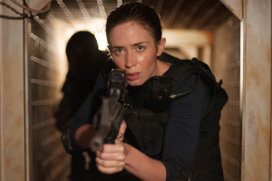 Emily Blunt holds a gun in SICARIO.
