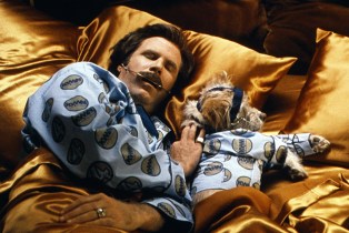 Ron Burgundy (Will Ferrell) snuggles with his dog Baxter.