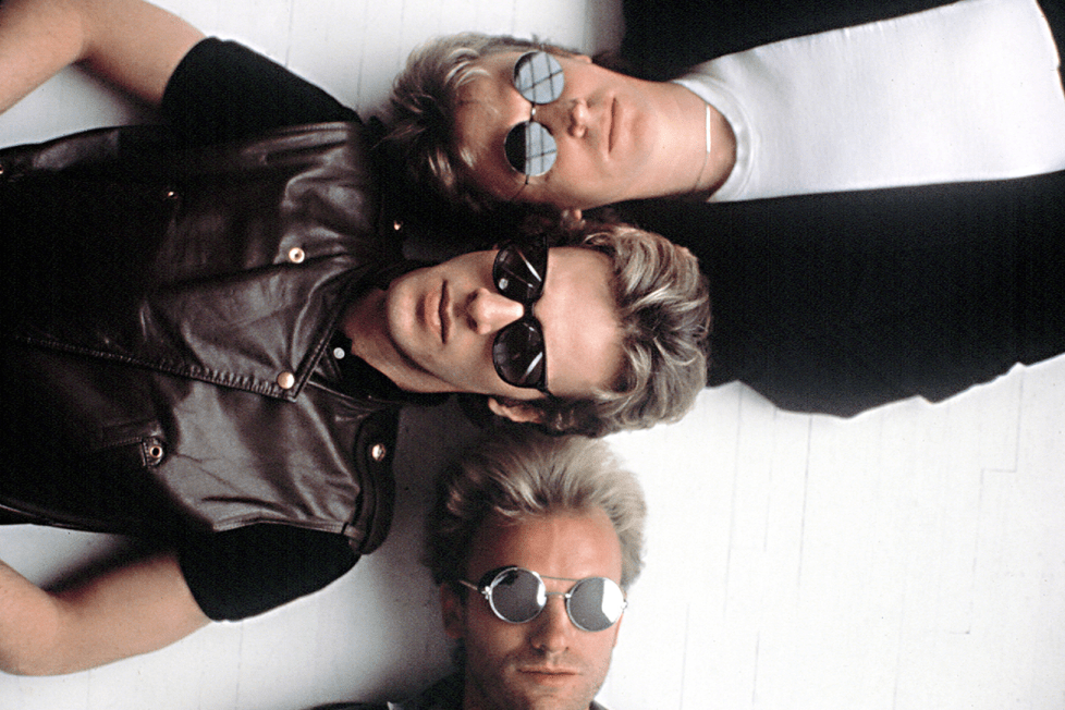 The Police, Andy Summers, Stewart Copeland, and Sting, publicity pose for SYNCHRONICITY CD, 1983.