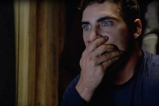 Signs: Joaquin Phoenix reacts to birthday party alien video