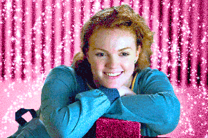 Sierra Burgess (Shannon Purser) smiling with sparkles all around her