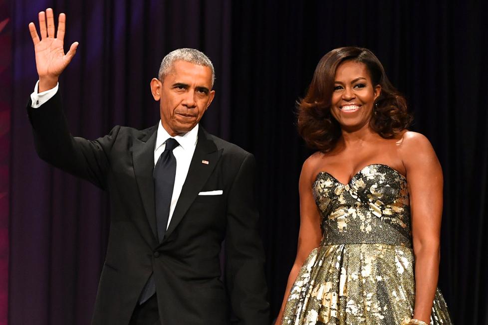 Barack and Michelle Obama waving