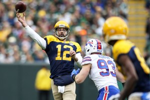 Aaron Rodgers throwing a pass