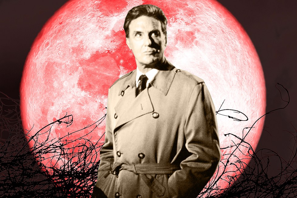 Robert Stack in front of a scary spooky set piece