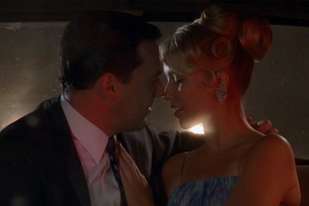 Jon Hamm and Anna Camp almost kissing in 'Mad Men'