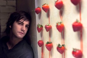 jim sturgess stares at a row of strawberries across the universe