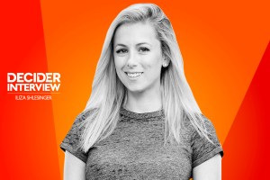 Iliza Shlesinger in black and white on a bright orange background